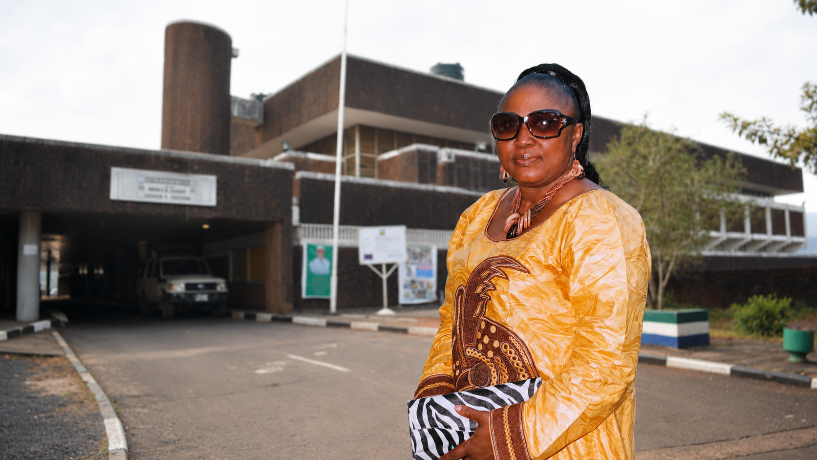 Honourable Rugiatu Rosy Kanu in front of the Parliament of Sierra Leone